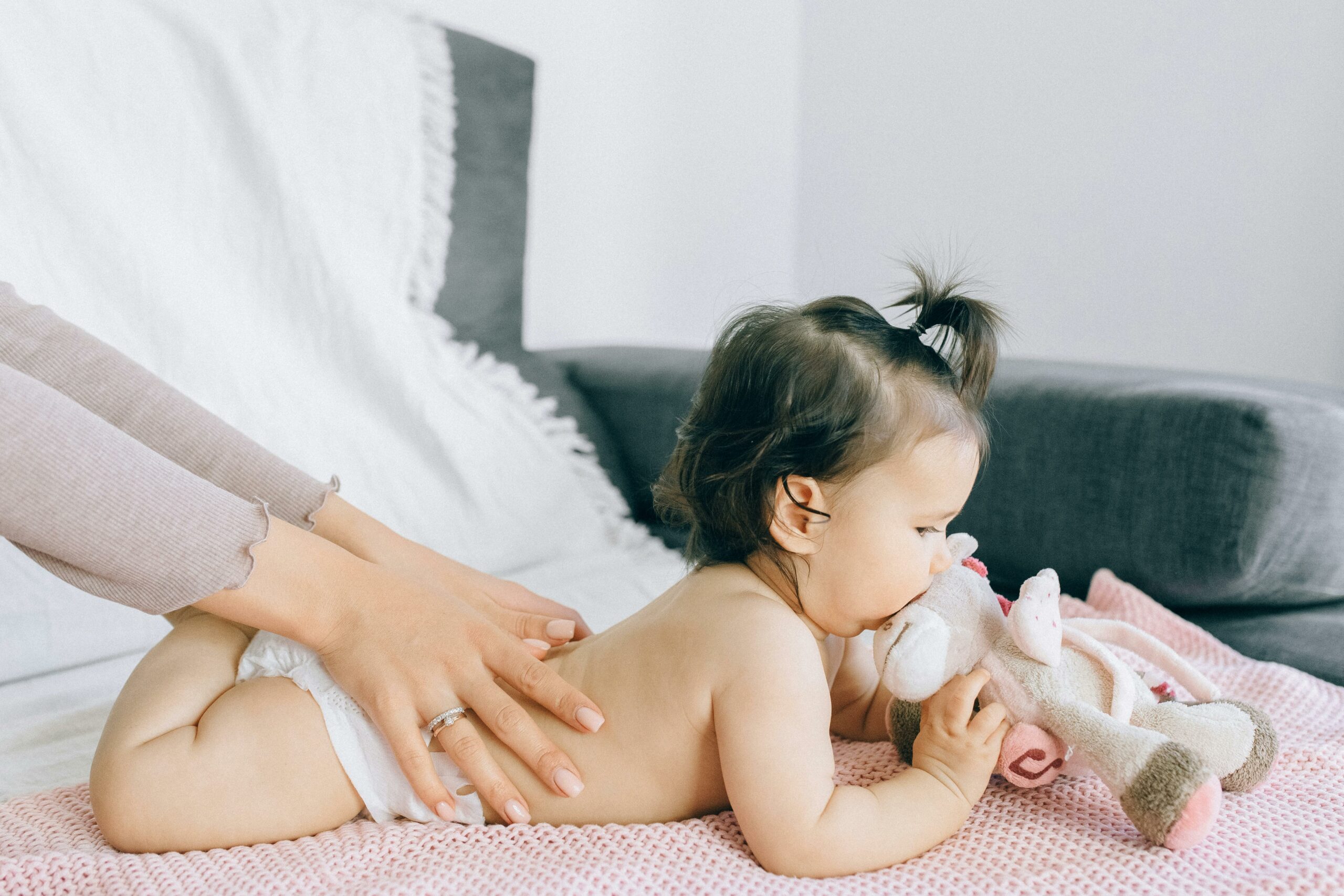 Baby lying on the bed